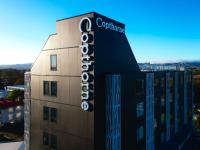 a building with a sign on top of it at Copthorne Hotel Palmerston North in Palmerston North