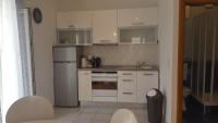 Kuchyň nebo kuchyňský kout v ubytování Apartments Karlo