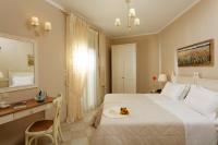 Łóżko lub łóżka w pokoju w obiekcie Ionia Suites