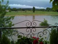 a view of a river from a iron fence at Riverside Home Cottage in Trèbes