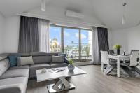 Ein Sitzbereich in der Unterkunft Waterlane Riverside - SPA, Pool, Gym &amp; Parking by Downtown Apartments