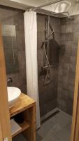 a bathroom with a shower and a sink at Hotel Du Clocher in Chamonix