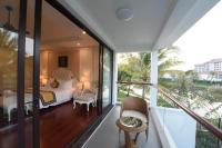 a bedroom with a bed and a balcony at Vinpearl Resort & Spa Phu Quoc in Phú Quốc