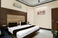 a bedroom with a large bed in a room at Super Townhouse Sushant Lok Phase 1 Formerly Hotel Neven in Gurgaon