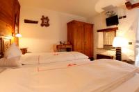 Łóżko lub łóżka w pokoju w obiekcie Eco Chalet Maison Dominique