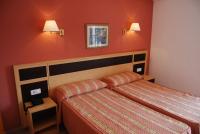 A bed or beds in a room at Hotel Santa Faz