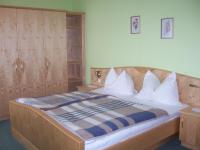A bed or beds in a room at Hotel Restaurant zum Schwan