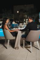 a man and a woman sitting at a table at Masseria Corsano in Nardò