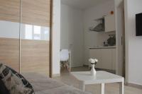 Televízia a/alebo spoločenská miestnosť v ubytovaní Apartment Iva