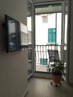 Televízia a/alebo spoločenská miestnosť v ubytovaní Apartment Iva