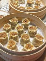 a group of small food dishes in a pan at Shanghai Zhuzhu Hotel - 24-hour free airport pick-up and drop-off at Pudong Airport in Shanghai