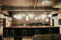 a bar in a room with stools at waves nakameguro in Tokyo