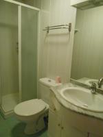 a bathroom with a toilet and a sink and a shower at Gite du plô in La Cresse