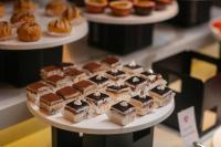 a bunch of desserts on a plate on a table at Aurora Oriental Hotel in Hanoi