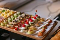 a buffet of appetizers and desserts on a table at Aurora Oriental Hotel in Hanoi