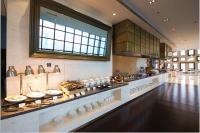 a kitchen with a counter with dishes on it at Radisson Blu Hotel Liuzhou in Liuzhou
