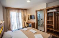 Postel nebo postele na pokoji v ubytování My Solmaz Hotel