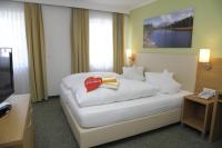 Postel nebo postele na pokoji v ubytování Familienhotel Hinteregger