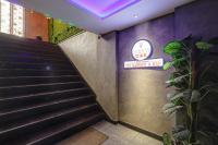 a set of stairs in a building with a sign at HOTEL OAK PLAZA - 1KM Connaught Place in New Delhi