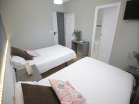 Postel nebo postele na pokoji v ubytování Hotel Alda Estación Vigo