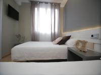 Postel nebo postele na pokoji v ubytování Hotel Alda Estación Vigo