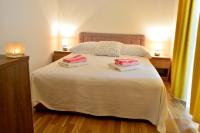 Posteľ alebo postele v izbe v ubytovaní Apartments M&B