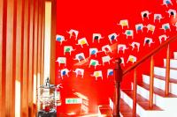 a red wall with an elephant stenciled on it at Ibali Hostel in Magong