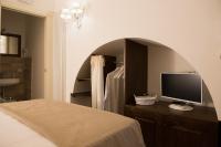 A bed or beds in a room at Antica Via Roma B&B E RELAX