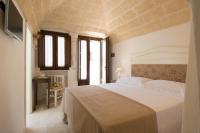 A bed or beds in a room at Antica Via Roma B&B E RELAX
