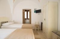 A bed or beds in a room at Antica Via Roma B&B E RELAX