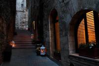 an alley with stairs and lights in a building at Camere Santa Chiara in Assisi