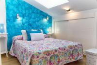 Posteľ alebo postele v izbe v ubytovaní Apartamentos Momas La Casa De Mamá