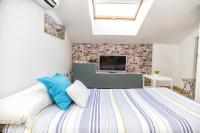 Posteľ alebo postele v izbe v ubytovaní Apartamentos Momas La Casa De Mamá