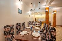 a dining room with a long table and chairs at Hotel Sun Ray Inn in Bhowāli