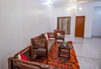a living room with three chairs and a table at Hotel Sun Ray Inn in Bhowāli