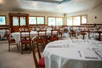 a dining room with tables and chairs with white table linen at Residenza Del Sole in Gressoney-Saint-Jean