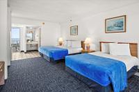 Ein Bett oder Betten in einem Zimmer der Unterkunft Beachcomber Motel