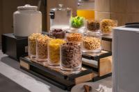 a display of different types of food in glass jars at Shanghai Elong Hotel by the bund and Nanjing road Pedestrian street in Shanghai