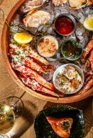 ein Teller mit Meeresfrüchten auf dem Tisch in der Unterkunft The Seagate Hotel, Golf & Beach Club, Autograph Collection in Delray Beach