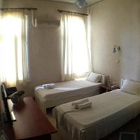 Posteľ alebo postele v izbe v ubytovaní Orfeas Hotel