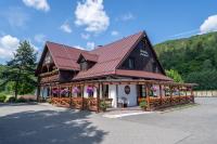 a large building with a red roof at Koliba Pod Horů in Dolní Bečva