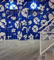 a blue tiled wall with white flowers on it at Delamar 4*Sup-Adults only (18+) in Lloret de Mar