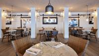 a restaurant with tables and chairs in a room at Delamar 4*Sup-Adults only (18+) in Lloret de Mar