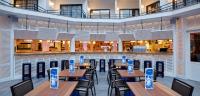 a row of tables and chairs in a restaurant at Delamar 4*Sup-Adults only (18+) in Lloret de Mar