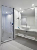 a bathroom with a sink and a shower with a mirror at Delamar 4*Sup-Adults only (18+) in Lloret de Mar