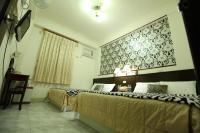 a hotel room with two beds and a window at Relax heart B&amp;B in Dongshan