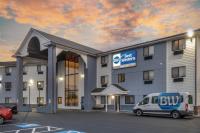 a building with a van parked in a parking lot at Best Western Providence Warwick Airport Inn in Warwick