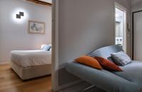 Posteľ alebo postele v izbe v ubytovaní Piazza Vittorio Suites