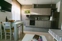 Kuchyňa alebo kuchynka v ubytovaní Maistros Kardamyli Apartments