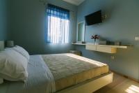 Posteľ alebo postele v izbe v ubytovaní Maistros Kardamyli Apartments